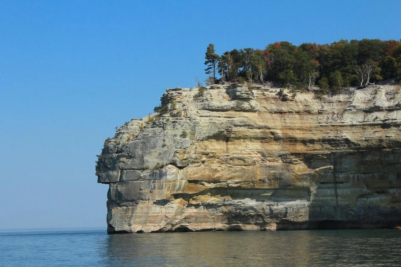 Sandstone cliffs of Pictured Rocks National Lakeshore rising from Lake Superior