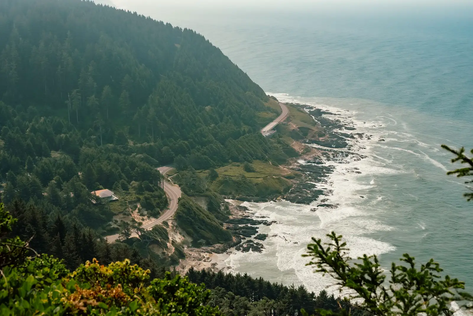 US 101 curving along the shoreline far below the Cape Perpetua overlook on the central Oregon coast